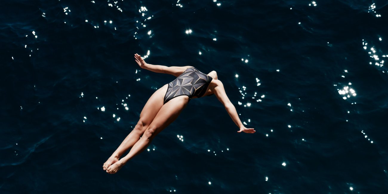 Woman diving into the ocean